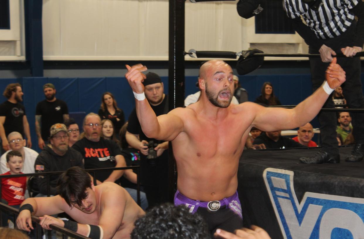 Chael Connors of Hornell takes his match with Griffin McCoy outside the ring and to the fans during Xcite Wrestling's first-ever event in Hornell Saturday, March 30, 2024 at the YMCA.