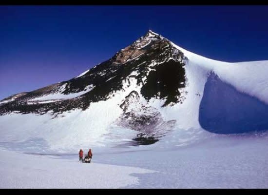 Mt. Early, Earth’s southernmost volcano, displays a yellow mantle at its summit composed of palagonite, a yellow, volcanic glass that was fragmented during the eruption of magma into overlying ice of the previously relatively higher East Antarctic Ice Sheet.