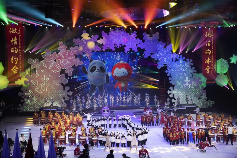 Beijing 2022 Winter Olympic Mascot Bing Dwen Dwen, left on screen and 2022 Winter Paralympic Games mascot Shuey Rong Rong, right on screen are revealed during a ceremony held at the Shougang Ice Hockey Arena in Beijing on Tuesday, Sept. 17, 2019. (AP Photo/Ng Han Guan)