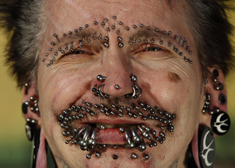 Guinness World Record holder for the 'Most Pierced Man', Rolf Bucholz of Germany, poses showing some of his 453 piercings in Dortmund, October 24, 2011. REUTERS/Ina Fassbender