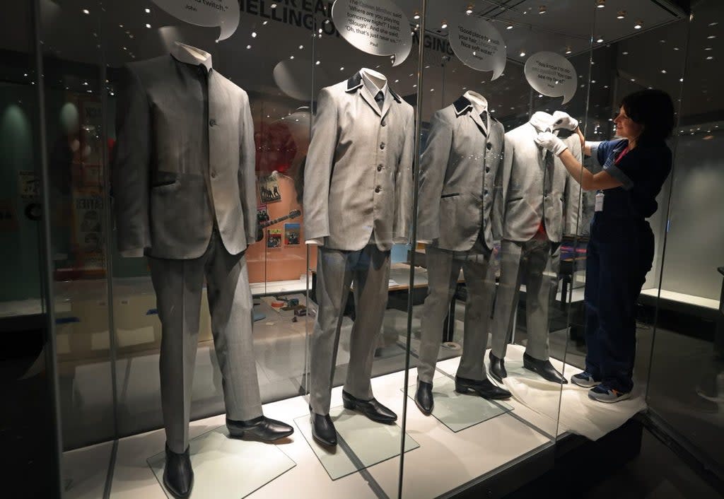 Assistant curator Lisa Peatfield arranges Ringo Starr’s suit as the Museum of Liverpool prepares to reopen its Wondrous Place gallery, celebrating the influence of people from Liverpool (Gareth Jones/PA)