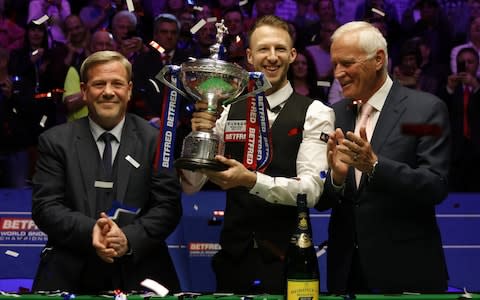 Barry Hearn (right) applauds Judd Trump - Credit: getty images