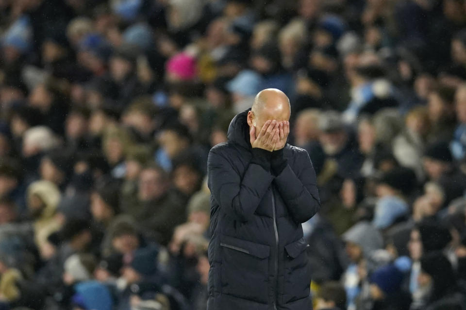 Manchester City's head coach Pep Guardiola reacts after Manchester City's Erling Haaland missed a chance to score during the English Premier League soccer match between Manchester City and Tottenham Hotspur at Etihad stadium in Manchester, England, Sunday, Dec. 3, 2023. (AP Photo/Dave Thompson)