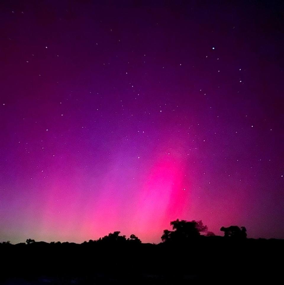 The northern lights illuminate the skies over Santa Margarita in pinks and purples on May 10, 2024.