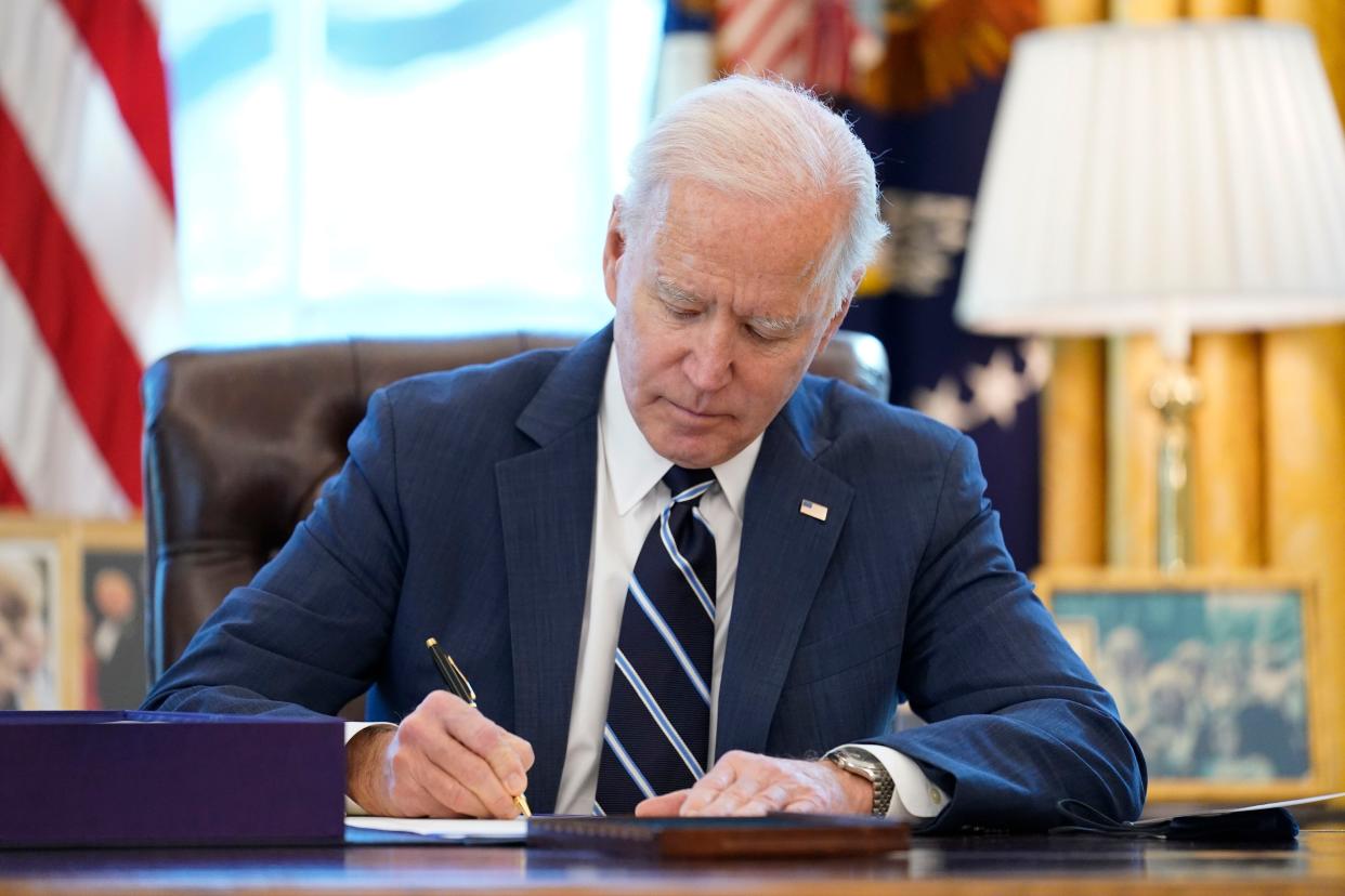 President Biden signs the American Rescue Plan on Thursday.
