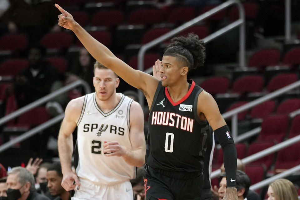 Houston Rockets guard Jalen Green (0) reacts after making a three point basket during the first half of an NBA basketball game against the San Antonio Spurs, Tuesday, Jan. 25, 2022, in Houston. (AP Photo/Eric Christian Smith)