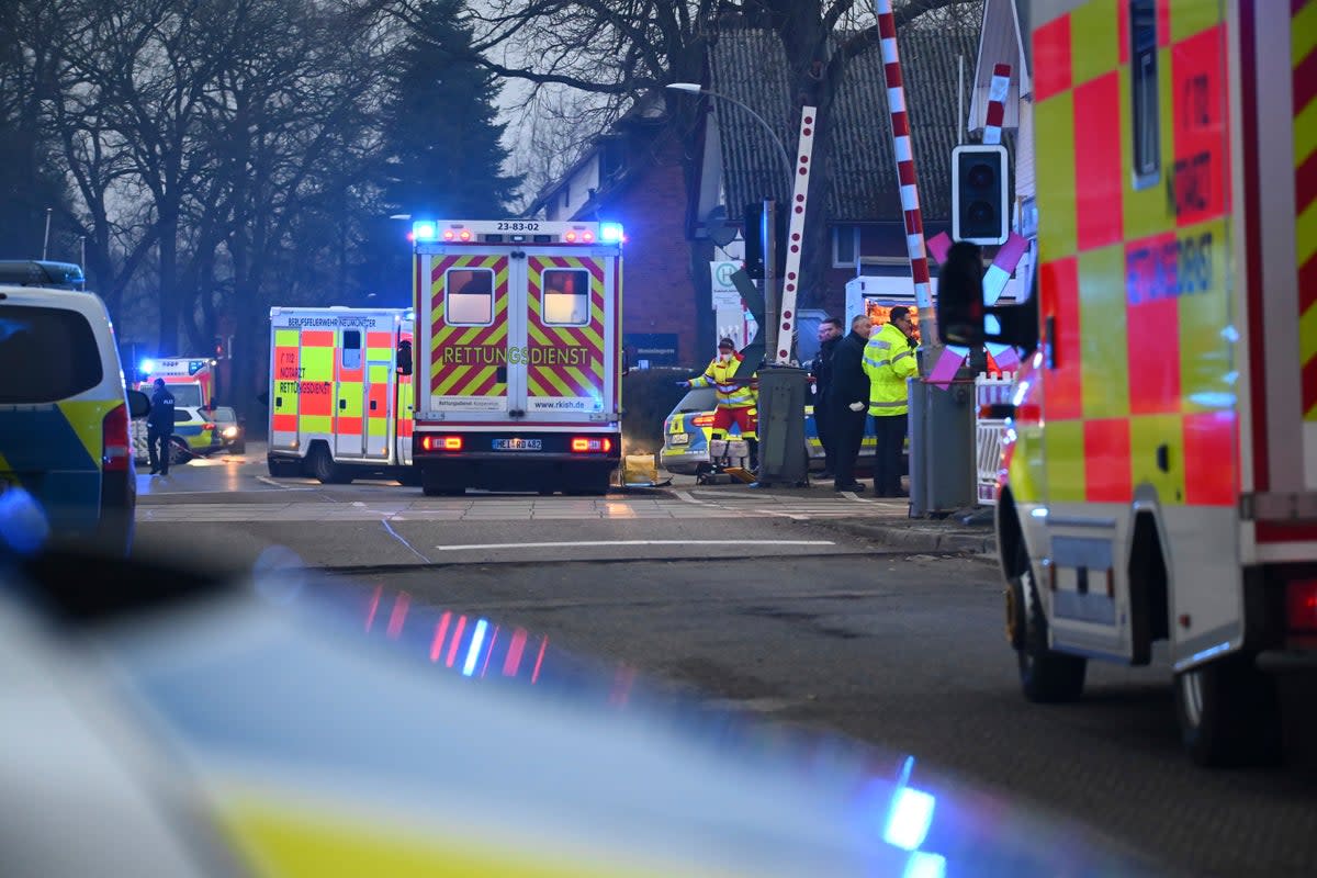 Police and rescue services near Brokstedt station in Germany after Wednesday’s stabbing (AP)