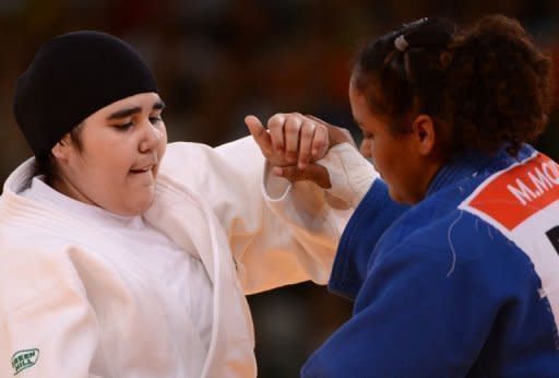 Saudi Arabia's Wojdan Shaherkani (L) during her women's +78kg judo match against Puerto Rico's Melissa Mojica at the London Olympics on August 3. Shaherkani lasted a mere 82 seconds after a build-up which had been overshadowed by a row concerning her hijab