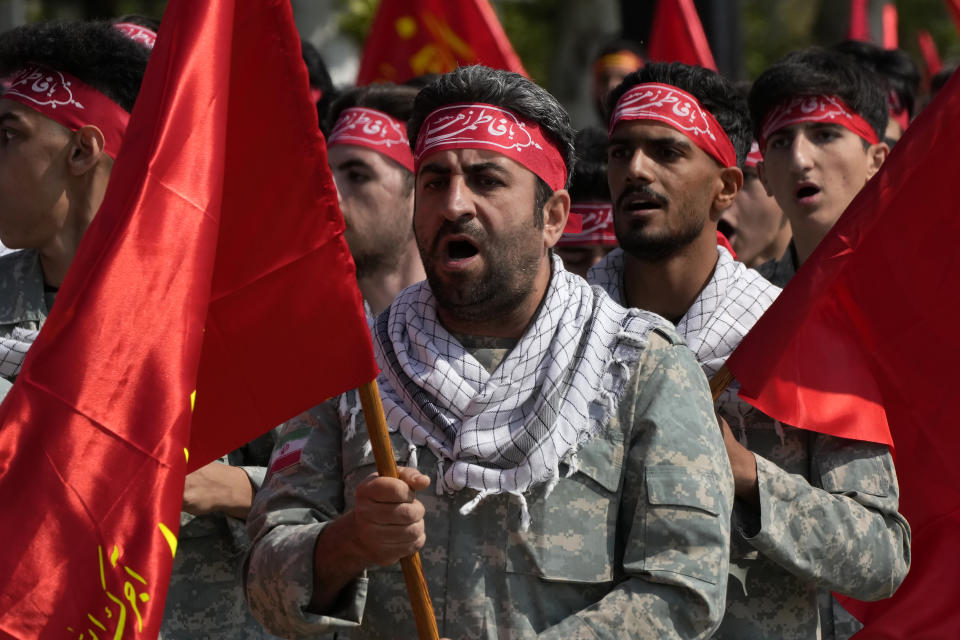 Volunteer troops of the Iranian army march during Army Day parade at a military base in northern Tehran, Iran, Wednesday, April 17, 2024. In the parade, President Ebrahim Raisi warned that the "tiniest invasion" by Israel would bring a "massive and harsh" response, as the region braces for potential Israeli retaliation after Iran's attack over the weekend. (AP Photo/Vahid Salemi)