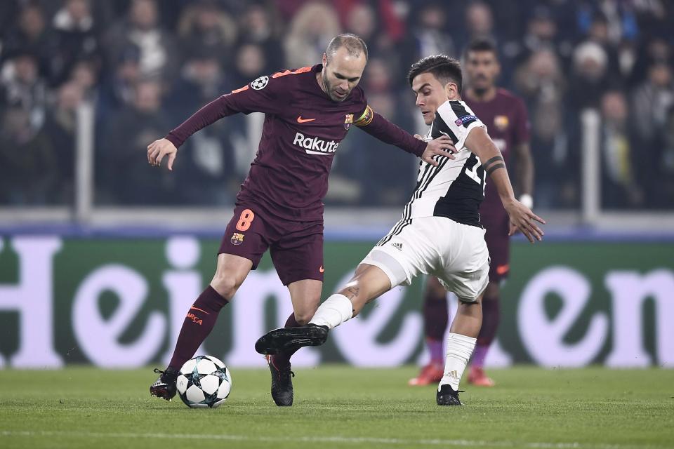 Barcelona’s Andres Iniesta and Juventus’ Paulo Dybala battled in midfield while Leo Messi rested on the Barca bench. (Getty)