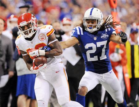 Jan 4, 2014; Indianapolis, IN, USA; Kansas City Chiefs receiver Dwayne Bowe (82) is called out of bounds while catching a pass against Indianapolis Colts corner back Josh Gordy (27) in the fourth quarter of the 2013 AFC wild card playoff football game at Lucas Oil Stadium. Mandatory Credit: Thomas J. Russo-USA TODAY Sports