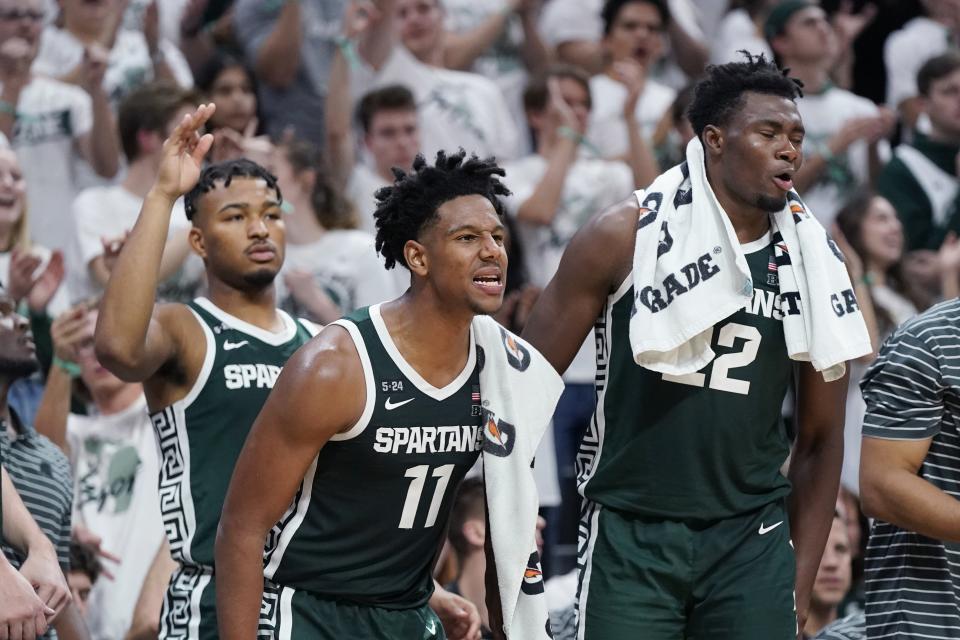 Michigan State guard A.J. Hoggard, center, and center Mady Sissoko cheer during the second half of MSU's 73-56 exhibition win on Tuesday, Nov. 1, 2022, in East Lansing.