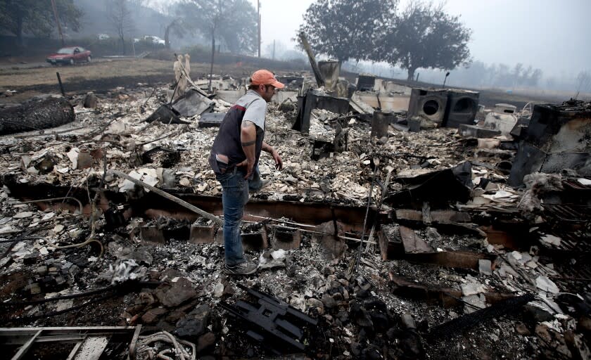 YREKA, CALIF. - AUG. 1 , 2022. James Benton looks at the remains of his home, which were destroyed by the McKinley fire as it burned along Highway 96 near Yreka over the weekend. The fire has charred about 51,000 acres and destroyed dozens of homes and structures. (Luis Sinco / Los Angeles Times)