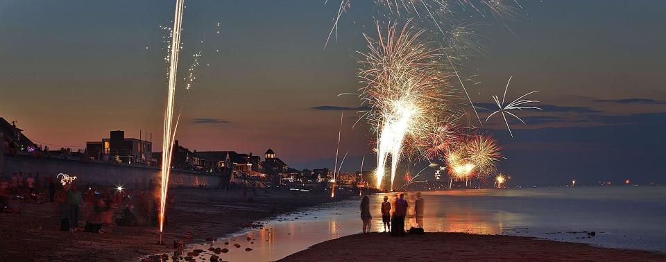 The sky explodes in color at Marshfield's Sunrise Beach with fireworks just after dark on Wednesday, July 3, 2019.