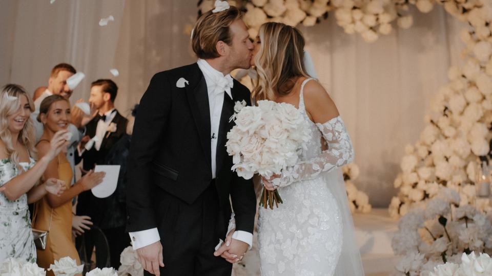 Olly Murs and his wife Amelia were pictured kissing following their ceremony