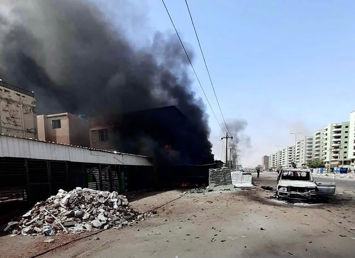 Battle-damaged street in Khartoum, Sudan (EPA)