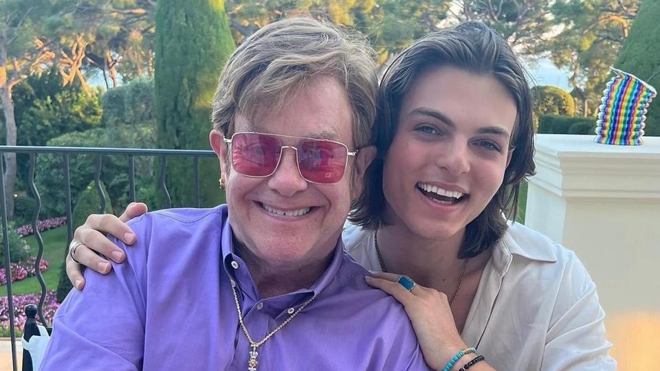 A photo of Elton John smiling with Damian Hurley