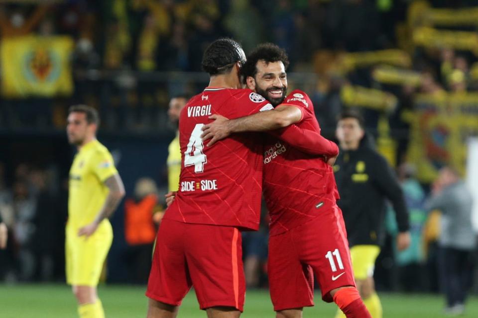 Virgil van Dijk and Mohamed Salah celebrate (AP)