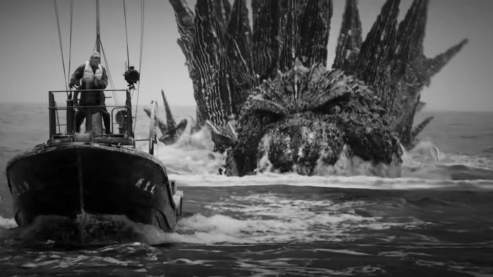  Godzilla swims after a small boat attacking him in Godzilla Minus One Minus Color. 