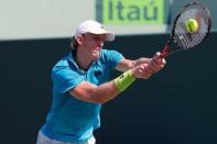 Kevin Anderson hits a backhand against Andy Murray (not pictured) on day nine of the Miami Open at Crandon Park Tennis Center. Mandatory Credit: Geoff Burke-USA TODAY Sports