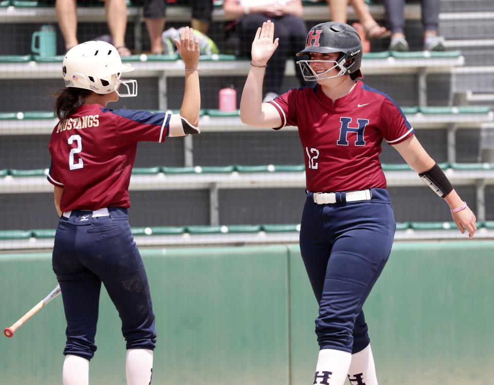 Herriman’s Tanzie Smith (2) high fives Brynnlee Murdock (12) in the 6A semifinal game against Skyridge High School at the Cottonwood Complex in Murray on Wednesday, May 24, 2023. | Laura Seitz, Deseret News