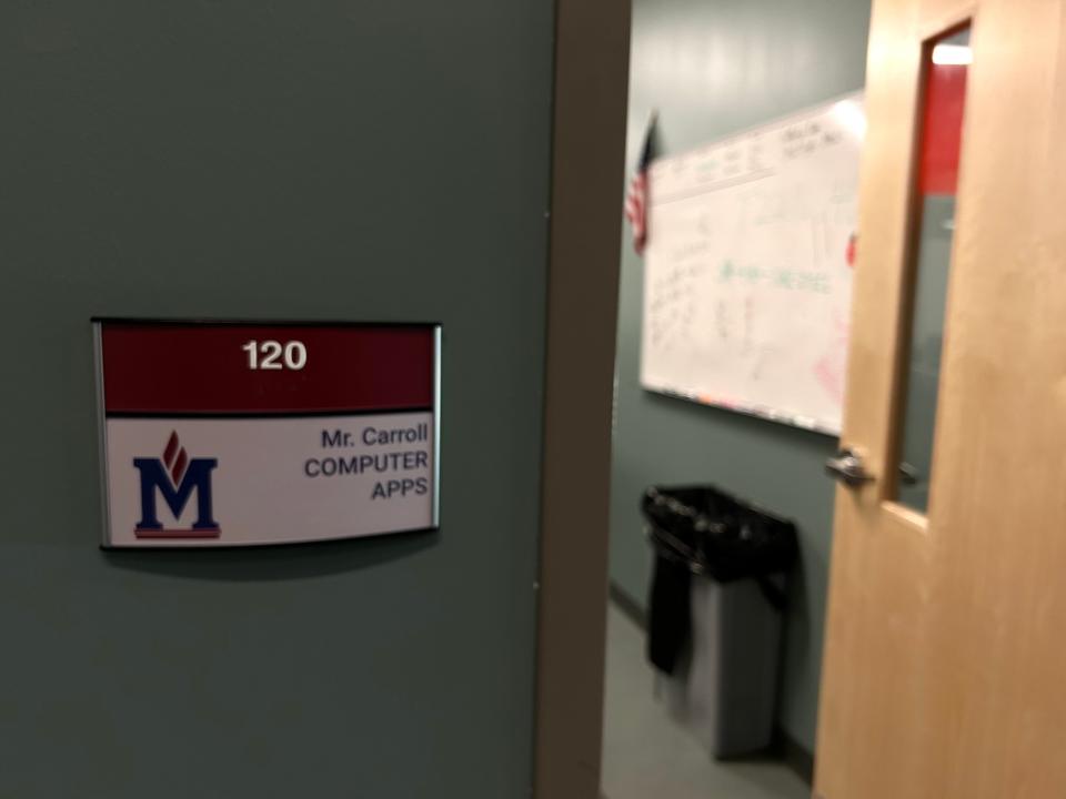 A sign shows the classroom of Garry Carroll, a computer applications teachers at Madison Academic High School, in Jackson, Tenn. on June 20, 2023.