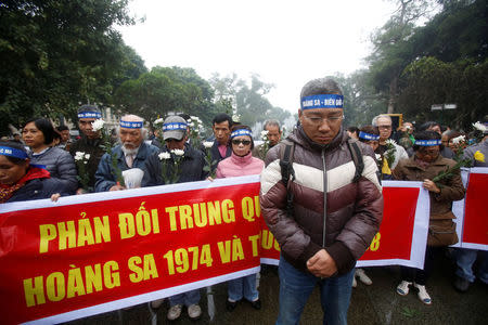 People take part in an anti-China protest to mark the 43th anniversary of the China's occupation of the Paracel Islands in the South China Sea in Hanoi, Vietnam January 19, 2017. REUTERS/Kham