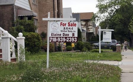 A "for sale" sign is seen outside a home in New York June 19, 2012. REUTERS/Shannon Stapleton