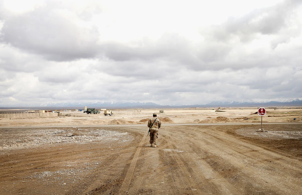A soldier on a deserted stretch of road on Forward Operating Base Shank, near Pul-e Alam, Afghanistan in 2014. (Scott Olson / Getty Images file)