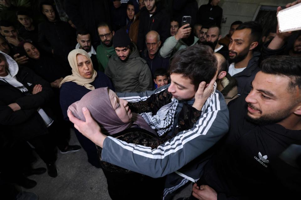 Palestinian prisoner Khalil Zama' (R) hugs his mother on November 27, 2023 after being released from an Israeli jail in exchange for Israeli hostages.