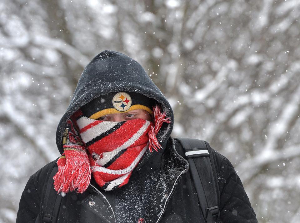 Sireah Drzewiecki, 31, walks to work along Peach Street in Millcreek Township on Feb. 14, 2020. Braving 16-degree temperatures and a -9 wind chill, Drzewiecki, made the 25-minute walk from her home at The Reserve at Millcreek to her job at Gordon's Meat Market in the 5000 block of Peach Street. On that morning, the Erie region saw the lowest temperatures of the year.