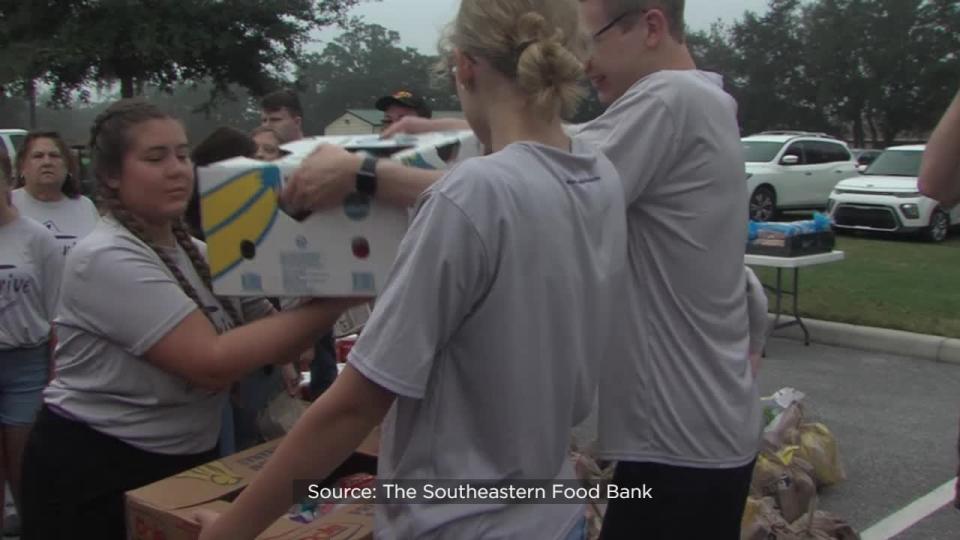 The food bank unloaded dozens of pallets of food and personal care products weighing a total of about 30 tons.