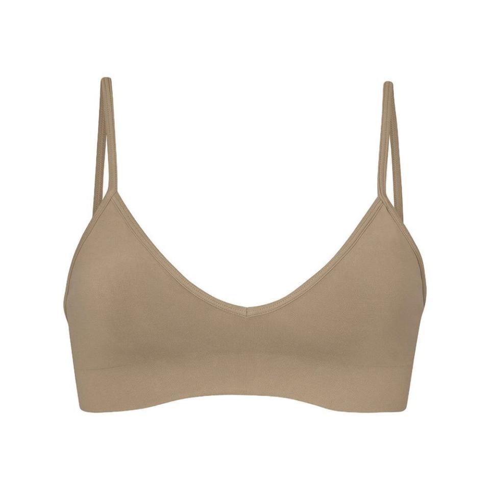 <p><a href="https://go.redirectingat.com?id=74968X1596630&url=https%3A%2F%2Fskims.com%2Fproducts%2Fsoft-smoothing-bralette-desert&sref=https%3A%2F%2F" rel="nofollow noopener" target="_blank" data-ylk="slk:Shop Now;elm:context_link;itc:0;sec:content-canvas" class="link ">Shop Now</a></p><p>Bralette </p><p>skims.com</p><p>$18.00</p>