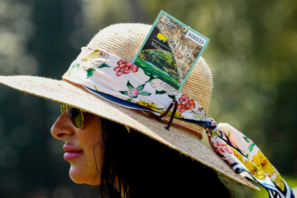 FILE - Apr 5, 2023; Augusta, Georgia, USA; A patron stores her pass in her hat during the Par 3 Contest at The Masters golf tournament at Augusta National Golf Club. Mandatory Credit: Rob Schumacher-USA TODAY Network