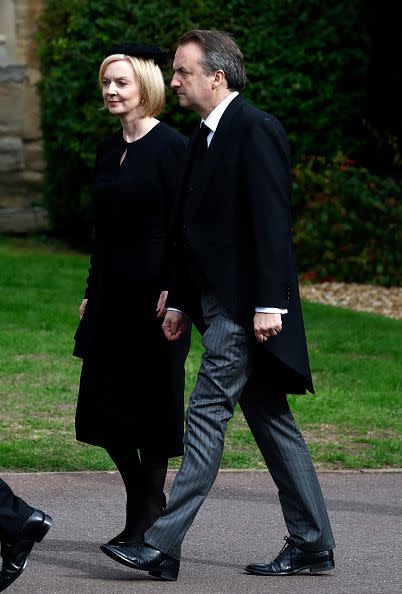 WINDSOR, ENGLAND - SEPTEMBER 19: Prime Minister of the United Kingdom, Liz Truss and Hugh O'Leary arrive at St. George's Chapel on September 19, 2022 in Windsor, England. The committal service at St George's Chapel, Windsor Castle, took place following the state funeral at Westminster Abbey. A private burial in The King George VI Memorial Chapel followed. Queen Elizabeth II died at Balmoral Castle in Scotland on September 8, 2022, and is succeeded by her eldest son, King Charles III. (Photo by Jeff J Mitchell/Getty Images)