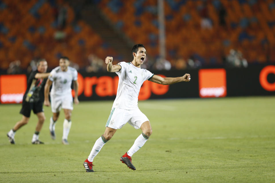 Algeria's Aissa Mandi celebrates after the African Cup of Nations semifinal soccer match between Algeria and Nigeria in Cairo International stadium in Cairo, Egypt, Sunday, July 14, 2019. (AP Photo/Ariel Schalit)