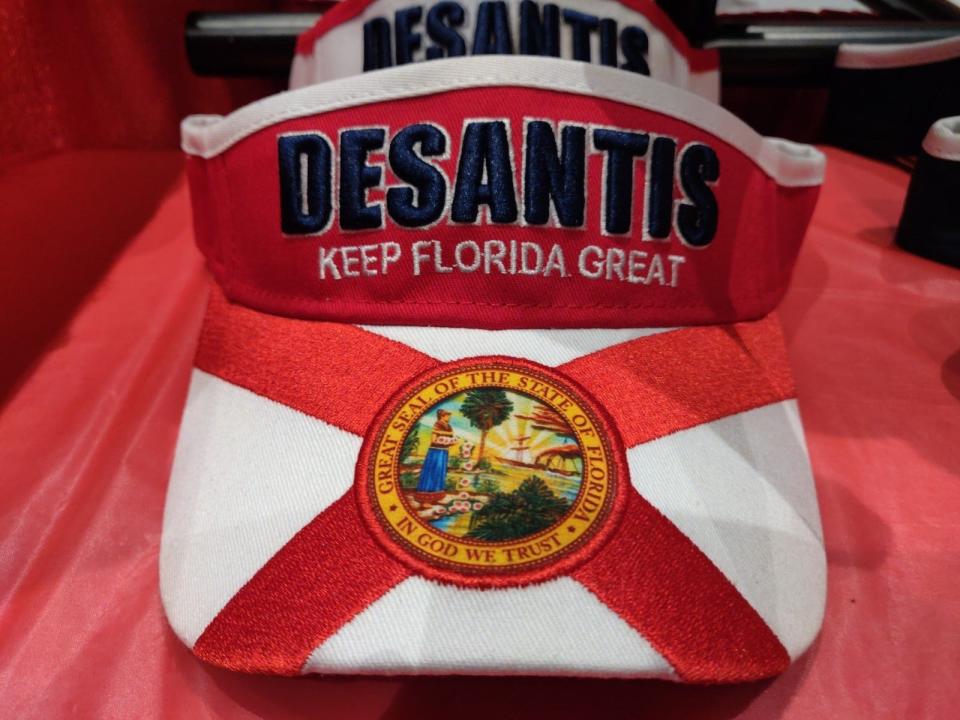 Visor for sale carrying the name of Florida Gov. Ron DeSantis, a Republican. DeSantis spoke at CPAC on Thursday.