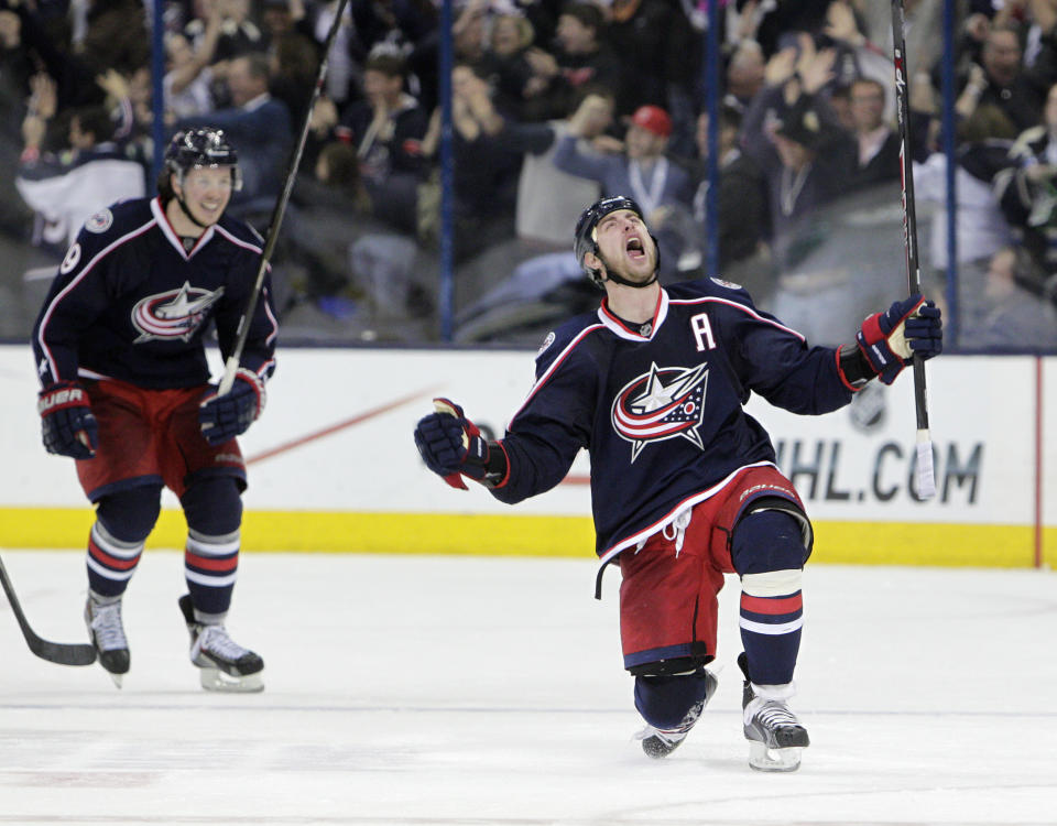 Columbus Blue Jackets' Brandon Dubinsky, right, celebrates his game-tying goal against the Pittsburgh Penguins during the third period of Game 4 of a first-round NHL playoff hockey series on Wednesday, April 23, 2014, in Columbus, Ohio. (AP Photo/Jay LaPrete)