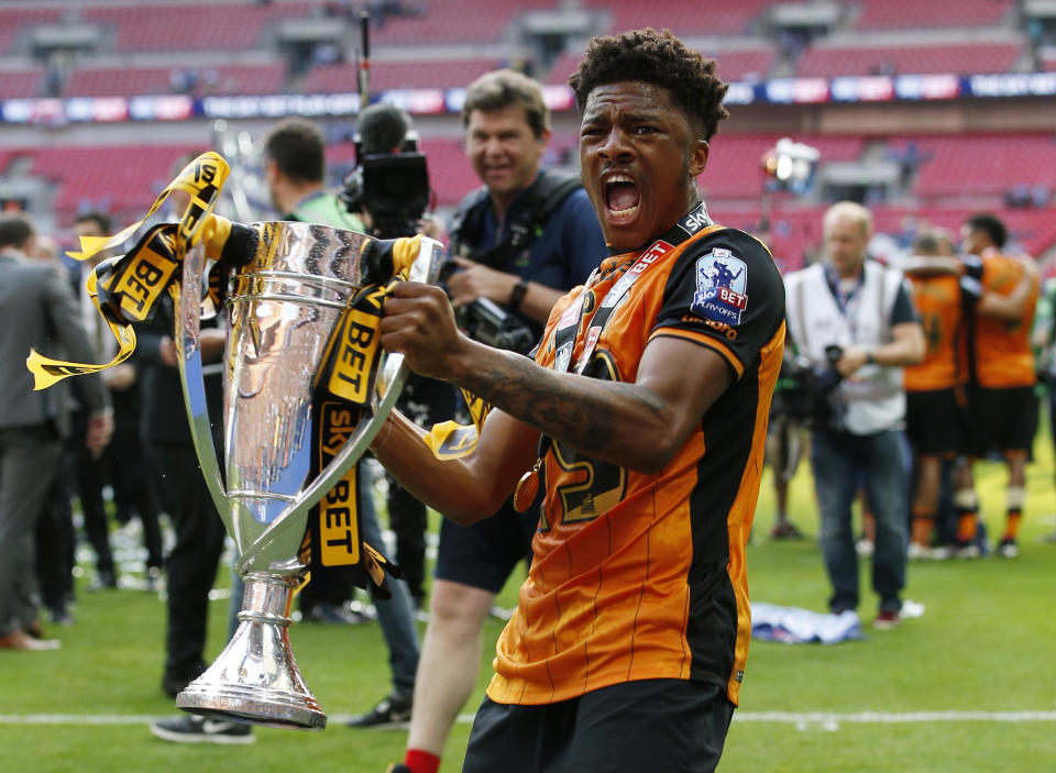 Britain Soccer Football - Hull City v Sheffield Wednesday - Sky Bet Football League Championship Play-Off Final - Wembley Stadium - 28/5/16 Hull City's Chuba Akpom celebrates with the trophy after winning promotion back to the Premier League Action Images via Reuters / Andrew Couldridge Livepic EDITORIAL USE ONLY. No use with unauthorized audio, video, data, fixture lists, club/league logos or "live" services. Online in-match use limited to 45 images, no video emulation. No use in betting, games or single club/league/player publications. Please contact your account representative for further details.