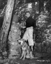 <p>Kirk Douglas takes his German Shepard, Banshee, for a walk during a production break on the set of his film <em>I Walk Alone</em>. </p>