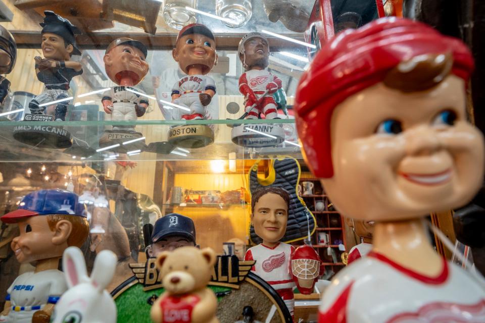 Bobble heads and other sports items sit for sale at a booth at the Livingston Antique Outlet in Howell on Monday, July 1, 2024.