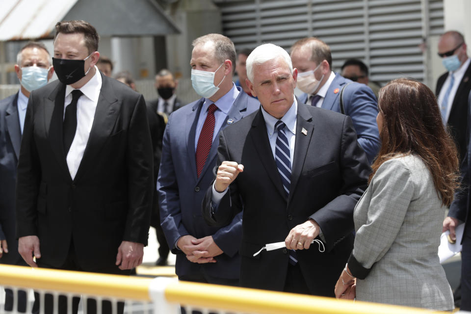 Vice President Mike Pence, his wife Karen, right, NASA administrator, Jim Bridenstine, center and CEO of SpaceX, Elon Musk, talk to the media after NASA astronauts Douglas Hurley and Robert Behnken left the Neil A. Armstrong Operations and Checkout Building on their way to Pad 39-A, at the Kennedy Space Center in Cape Canaveral, Fla., Wednesday, May 27, 2020. The two astronauts will fly on a SpaceX test flight to the International Space Station. For the first time in nearly a decade, astronauts will blast into orbit aboard an American rocket from American soil, a first for a private company. (AP Photo/John Raoux)