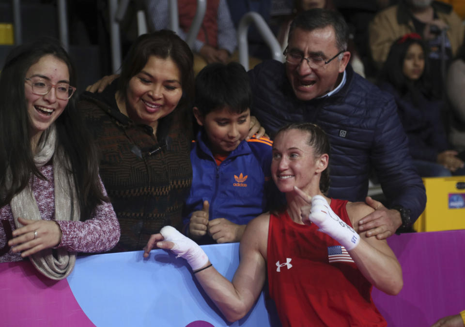 FILE - Virginia Fuchs of the United States poses with fans after her fight against Irismar Cardozo of Venezuela in the women's fly, 51 kg, boxing semifinal match at the Pan American Games in Lima, Peru, in this Tuesday, July 30, 2019, file photo. Fuchs’ obsessive-compulsive disorder sometimes compels her to use a dozen toothbrushes a night and to buy hundreds of dollars of cleaning products per week. Yet Fuchs is headed to Tokyo next week to compete in the Olympic boxing tournament, where she realizes it’s almost impossible to avoid touching the blood, sweat and spit of her opponents.(AP Photo/Fernando Llano, File)