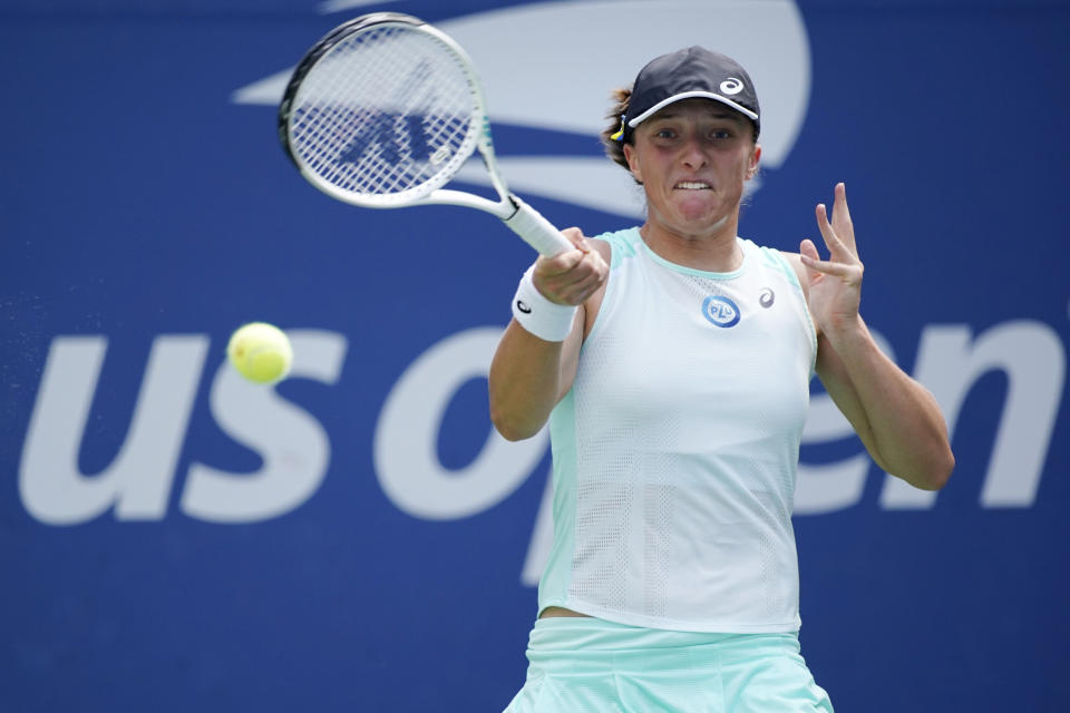 Iga Swiatek, of Poland, returns to Jule Niemeier, of Germany, during the fourth round of the U.S. Open tennis championships, Monday, Sept. 5, 2022, in New York. (AP Photo/Eduardo Munoz Alvarez)