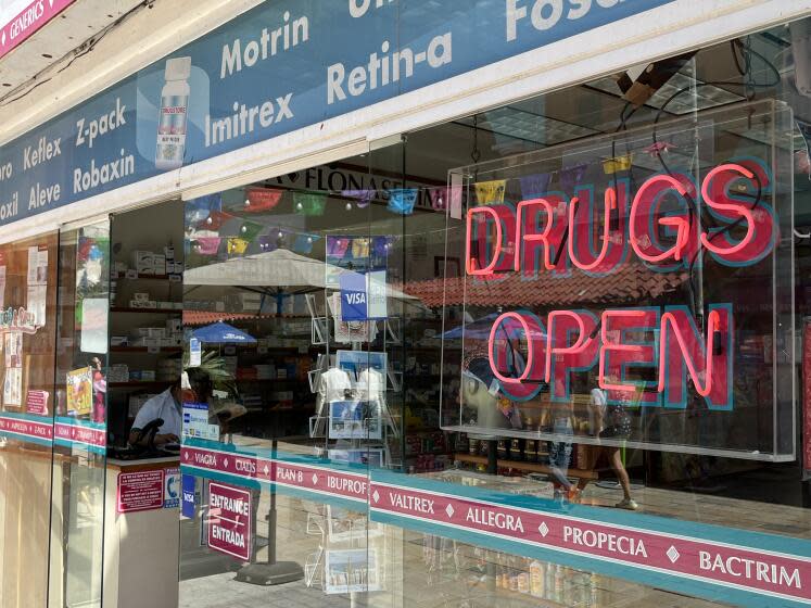 A drug store in Playa del Carmen advertises a range of medications.