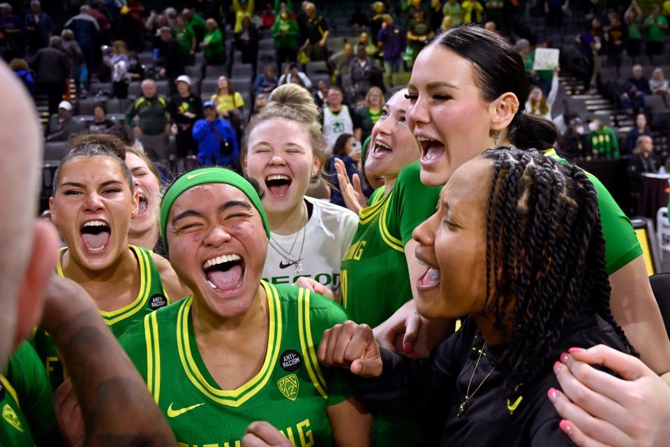 Oregon players celebrate their victory over Washington after the game in the first round of the Pac-12 women's tournament Wednesday, March 1, 2023, in Las Vegas.