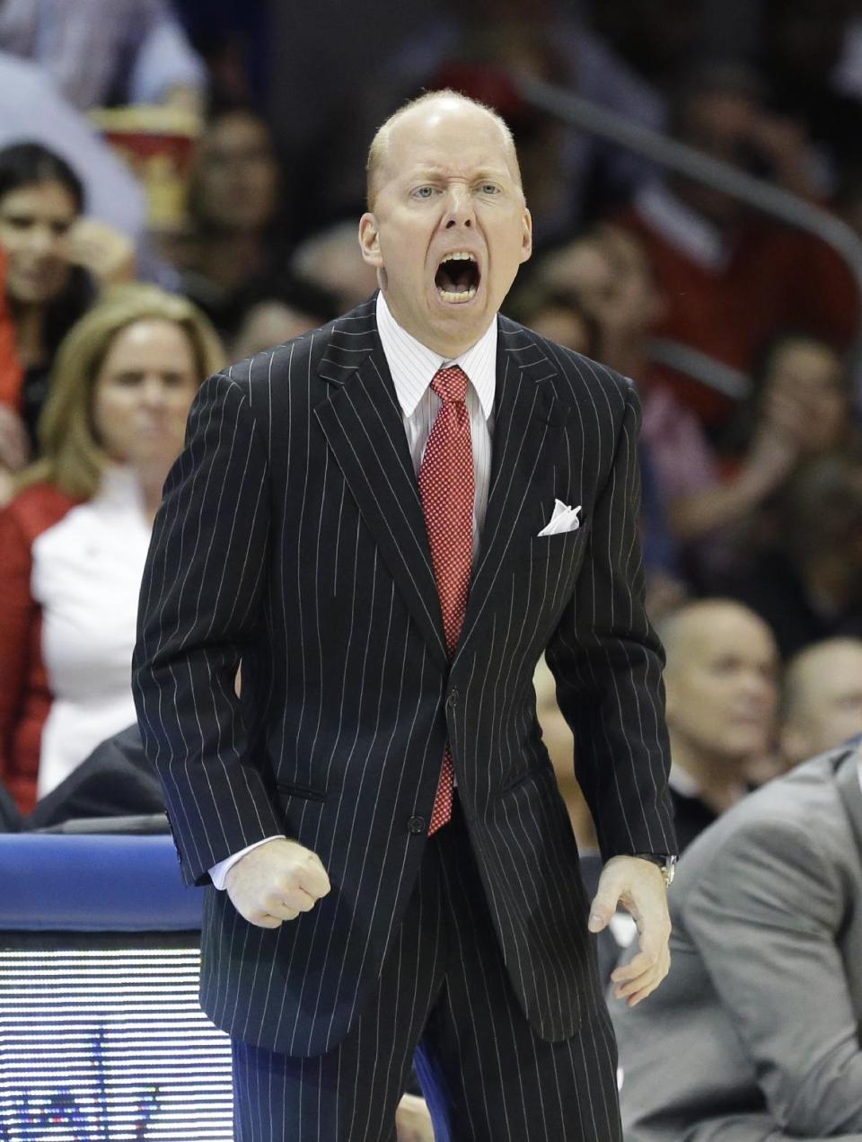 Cincinnati coach Mick Cronin yells from the sideline during the first half of an NCAA college basketball game against SMU on Saturday, Feb. 8, 2014, in Dallas. (AP Photo/LM Otero) vcb