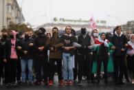 Belarusian opposition supporters hold a rally in Minsk