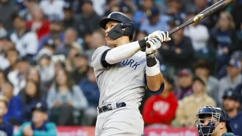 May 30, 2023;  Seattle, Washington, USA;  New York Yankees center fielder Aaron Judge (99) hits a solo home run against the Seattle Mariners in the seventh inning at T-Mobile Park.