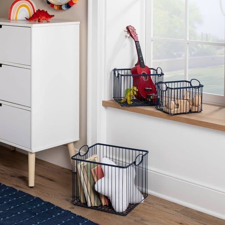 a set of storage bins hold toys